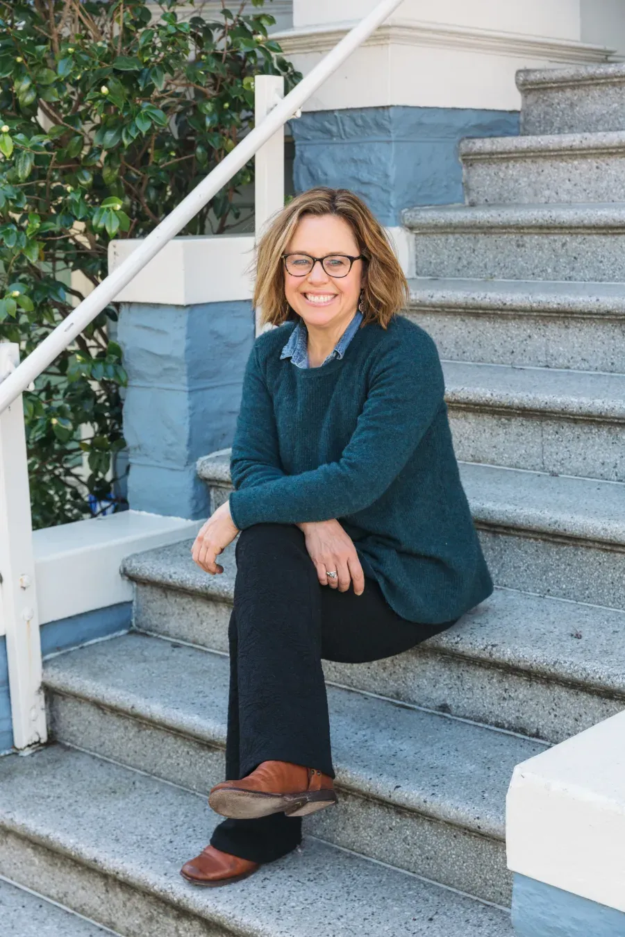 Laura Foulke seated on a set of steps
