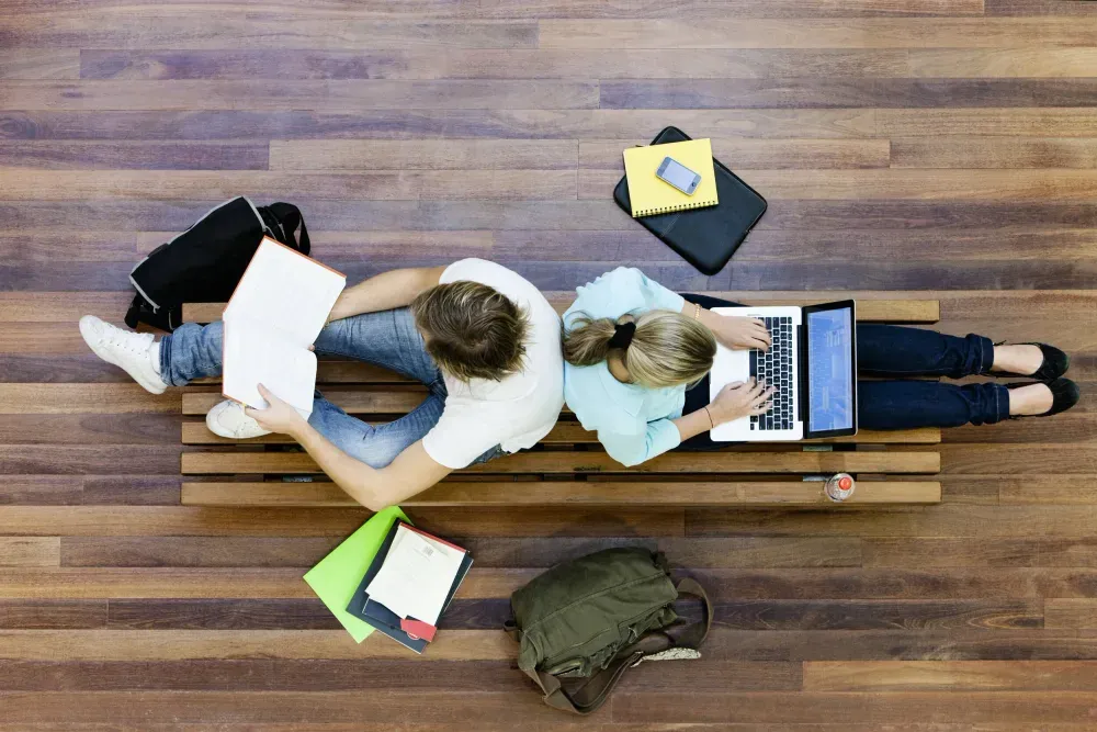 Two students studying together at a table
