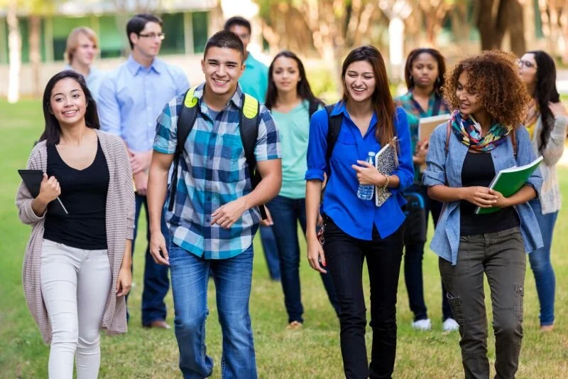 A group of students walking together on a college campus